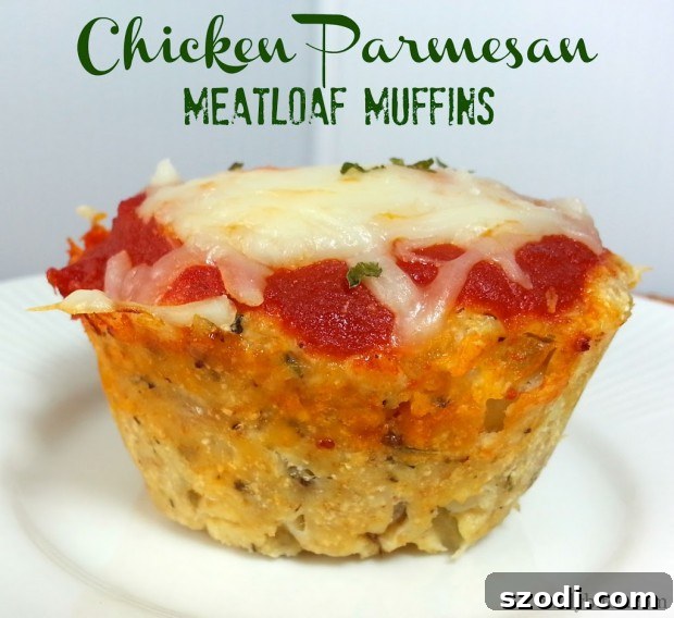 Close-up of baked Chicken Parmesan Meatloaf Muffins with melted cheese