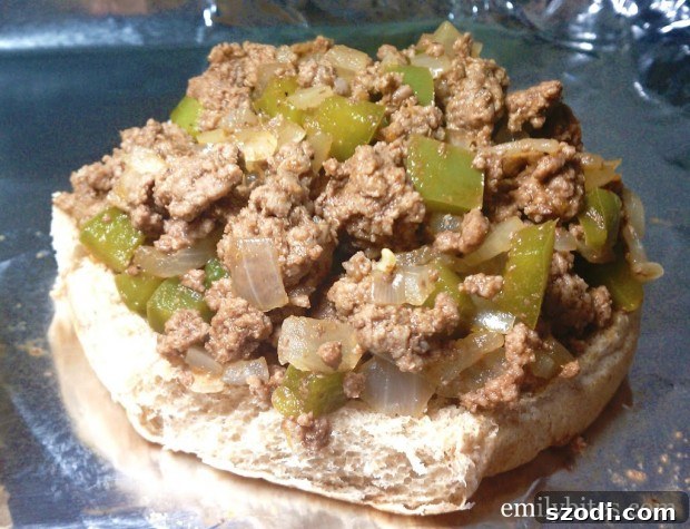 Close-up view of golden-brown Philly Cheesesteak Sloppy Joes with melted Provolone cheese.