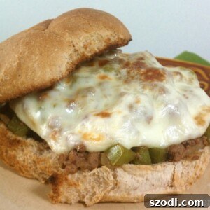 Top-down shot of prepared Philly Cheesesteak Sloppy Joes on a serving plate.