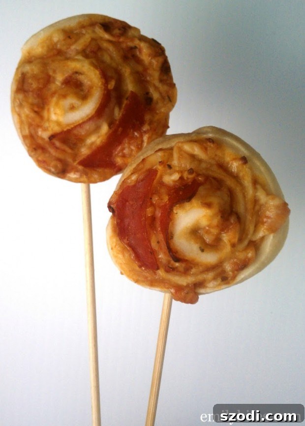 Pizza Pops 5 A platter filled with various pizza on a stick appetizers, ready for serving