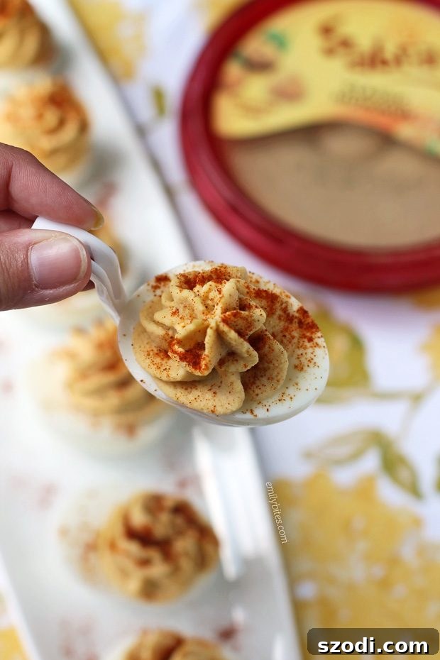 Close-up of creamy Hummus Deviled Eggs on a serving platter