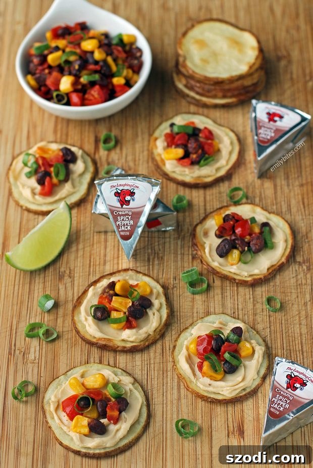 Delicious Fiesta Potato Rounds arranged on a platter, showcasing the vibrant toppings and creamy cheese.