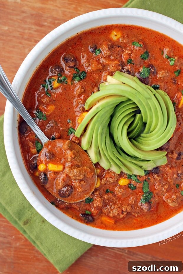 Hearty Beef Taco Soup 3 Close-up shot of Beef Taco Soup in a bowl, with a variety of fresh toppings