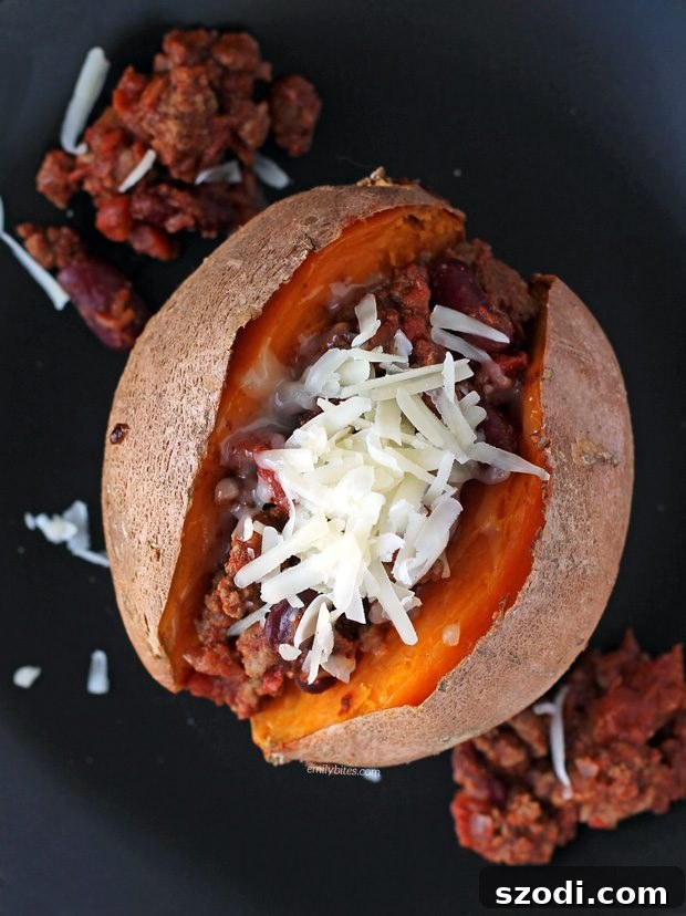 Chili Cheese Stuffed Sweet Potatoes served on a plate with green beans