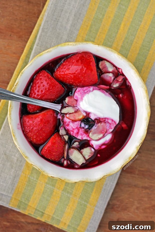 Close-up of a Triple Berry Yogurt Bowl, showcasing the layers of yogurt, berries, and toppings