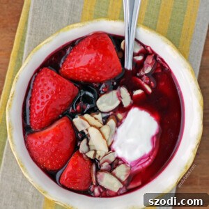 Triple Berry Yogurt Bowl with warm berries, Greek yogurt, and toppings