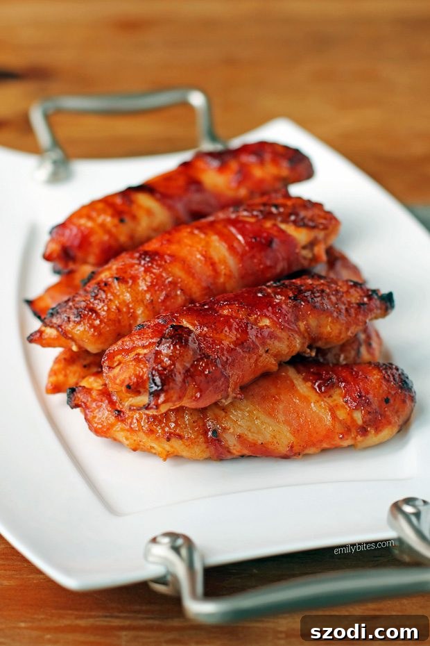 Crispy Bacon BBQ Chicken Tenders 4 Plated Barbecue Bacon Wrapped Chicken Tenders with fresh parsley garnish