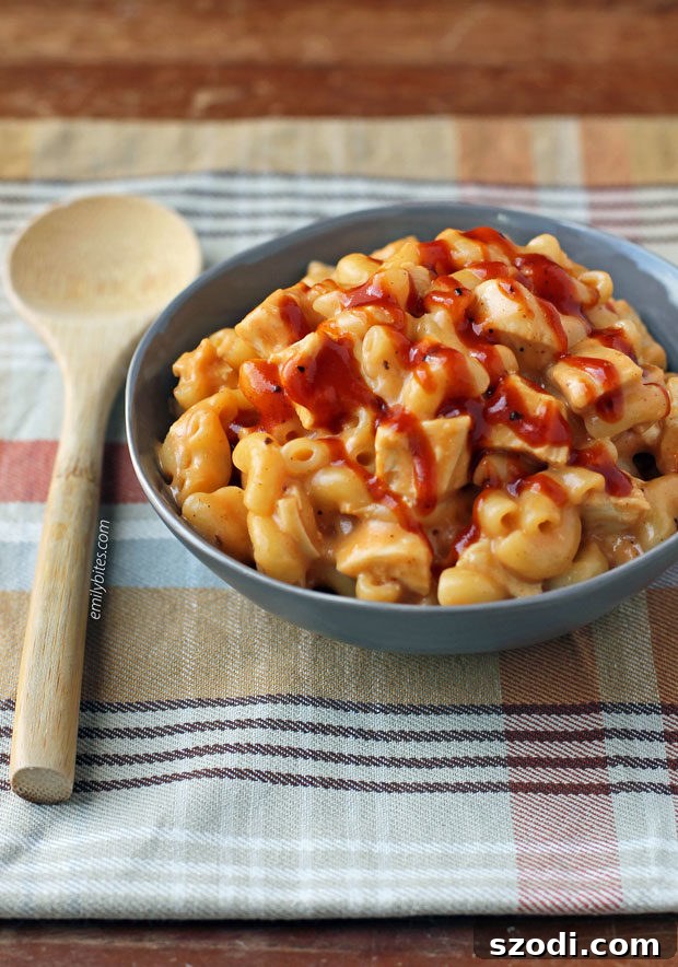 Smoky Barbecue Chicken Mac and Cheese Skillet 2 A hearty bowl of One-Pot Barbecue Chicken Mac and Cheese, garnished and ready to serve