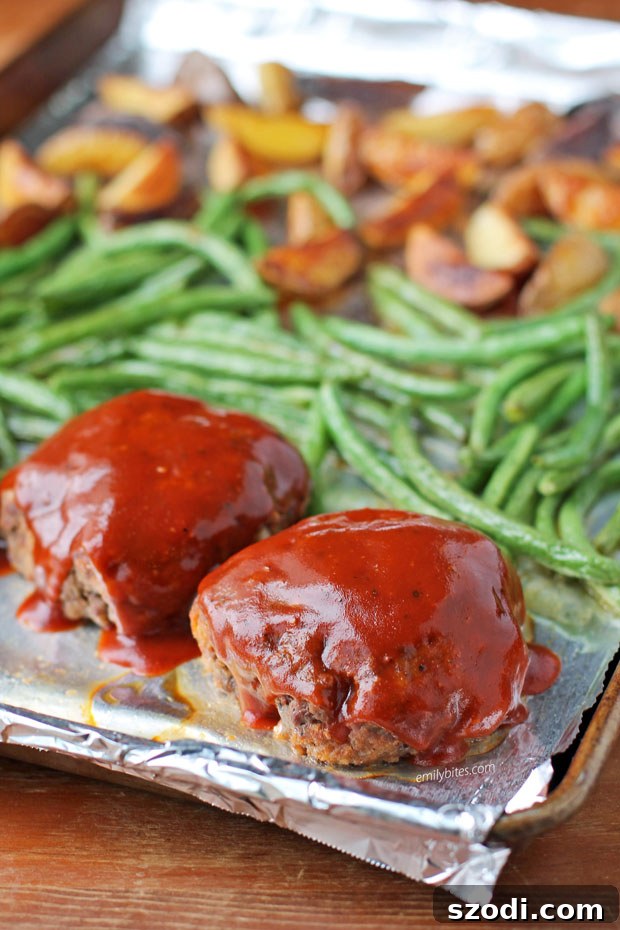 Sheet Pan Meatloaves with Roasted Potatoes and Green Beans on the pan