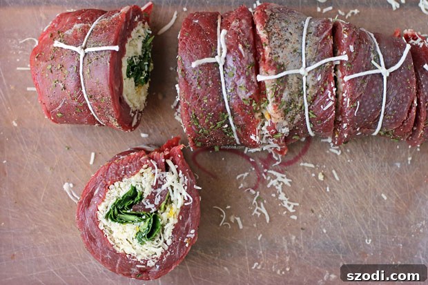 Garlic Parmesan Flank Steak Pinwheels sliced before cooking