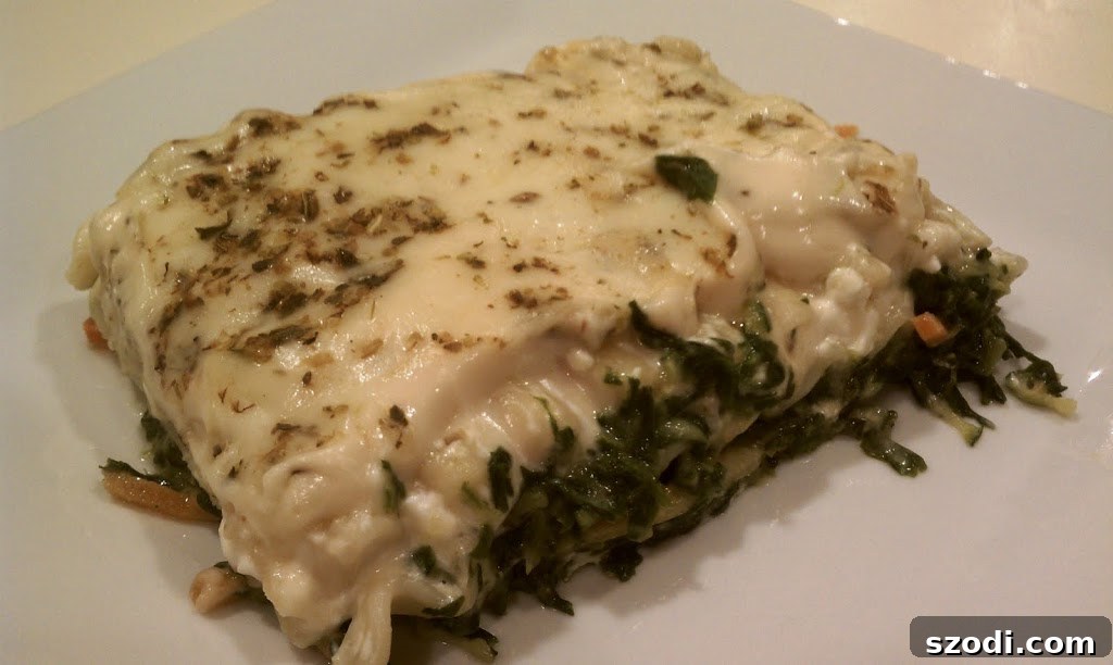 Creamy Veggie Lasagna 2 Delicious slice of White Vegetable Lasagna on a plate