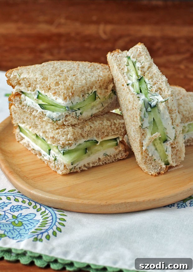 Cucumber Sandwich pieces stacked on a plate