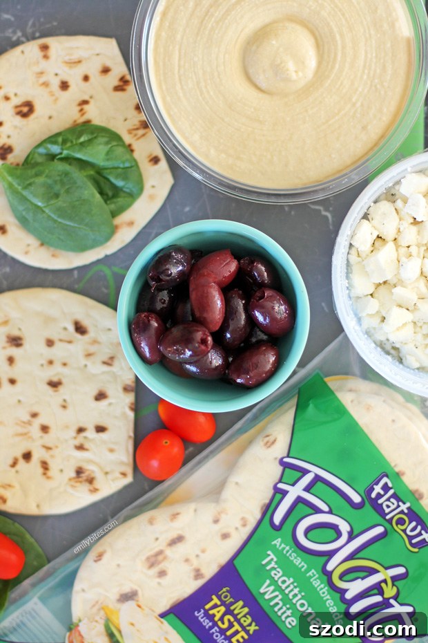 Hellenic Flatbread Crisps 3 Assembling a Greek Snack Flat with Hummus and Fresh Toppings