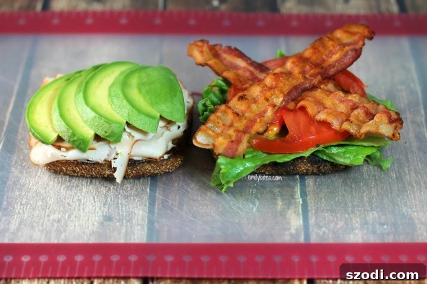 Close-up of a stacked California Club Sandwich half