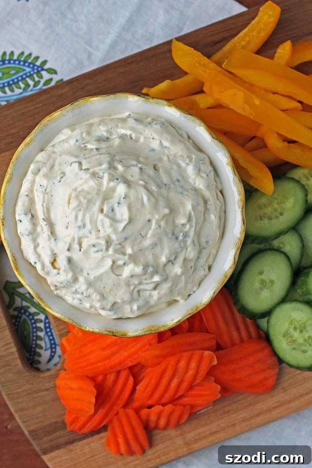 Velvet Veggie Delight 2 Creamy Veggie Dip served with a vibrant array of fresh carrots, cucumbers, and bell peppers for healthy snacking