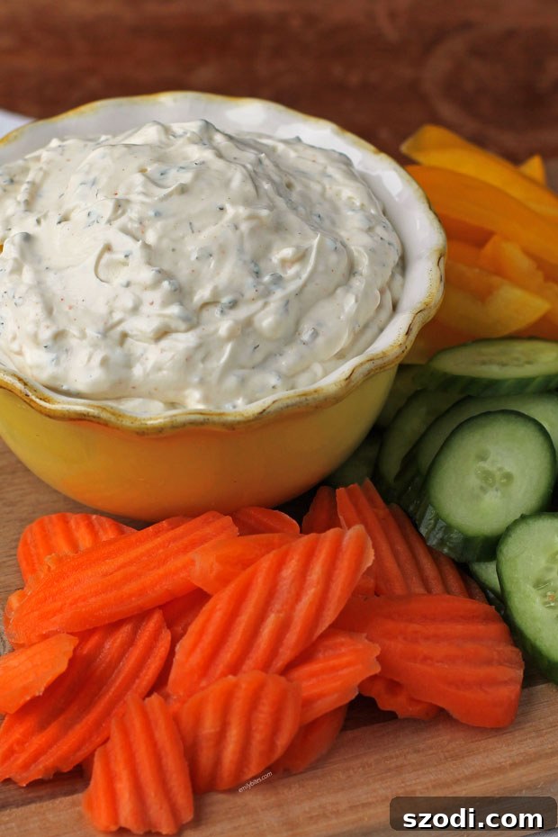 Velvet Veggie Delight 3 Close-up view of Creamy Veggie Dip in a rustic bowl, perfectly ready for dipping with an assortment of fresh vegetables