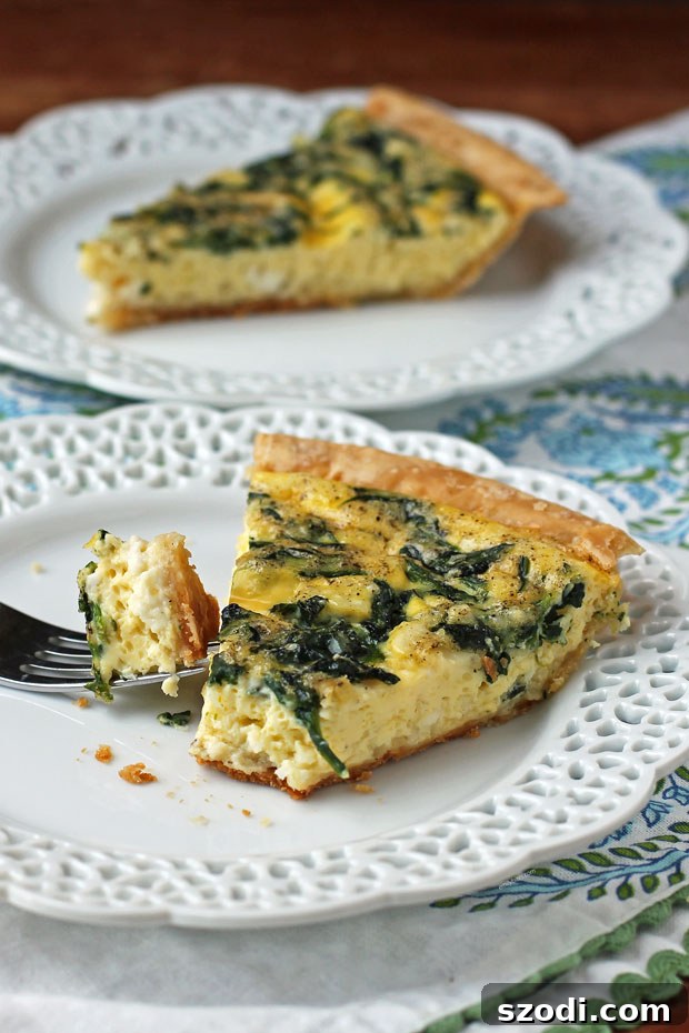 Spinach Feta Quiche slice on a plate
