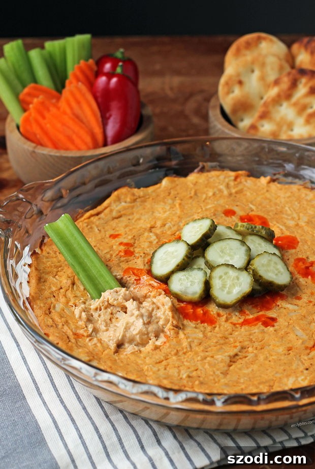 Nashville Hot Chicken Dip with celery dipped