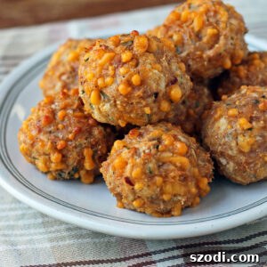 Bisquick Chicken Sausage Balls stacked on a plate close up