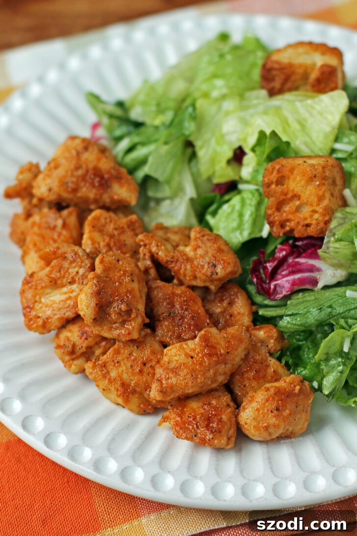 Brown Sugar Mustard Rubbed Chicken Bites plated with a fresh side salad, showcasing their versatility.