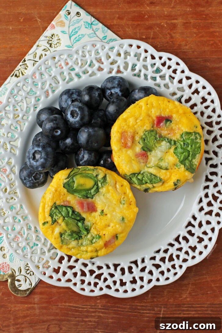 Ham and Swiss Egg Cups plated with blueberries