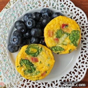 Ham and Swiss Egg Cups plated with blueberries