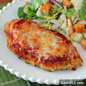 Chicken Pizzesan plated with salad