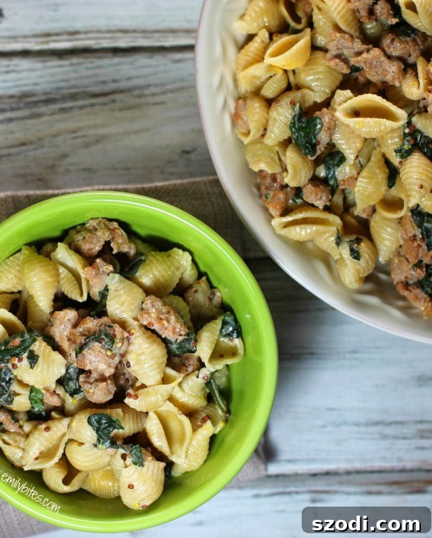 Close-up of Creamy Pasta with Sausage and Mustard Seeds in a Skillet