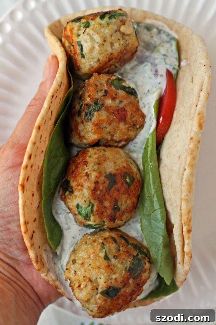 Greek Chicken Meatball Sandwich in hand